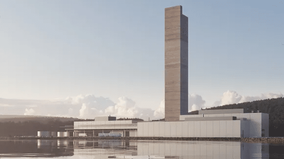 a tall tower next to a body of water